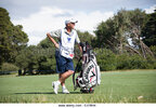 tmp_5416-golf-caddy-standing-with-golf-bag-on-the-fairway-hand-on-hip-casual-e478h4-534853898.jpg
