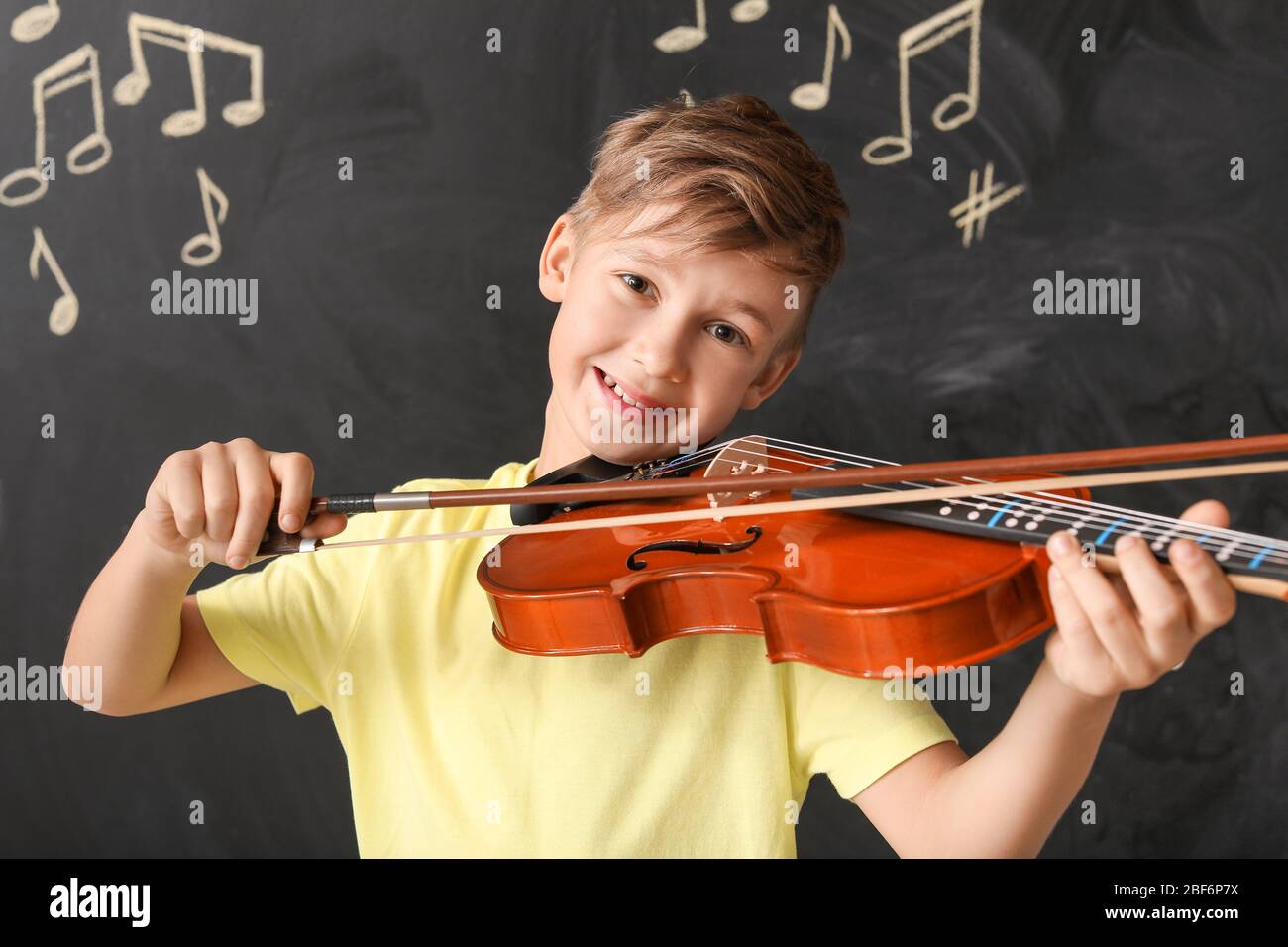 Little boy playing violin at music school Stock Photo - Alamy