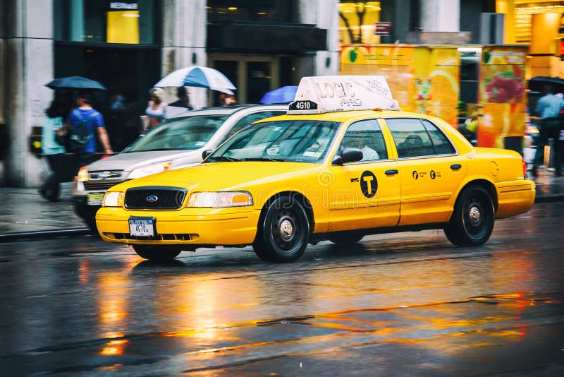 Taxi cab in New York City in the rain. Taxi cab in traffic on busy New York City street on rainy day stock images
